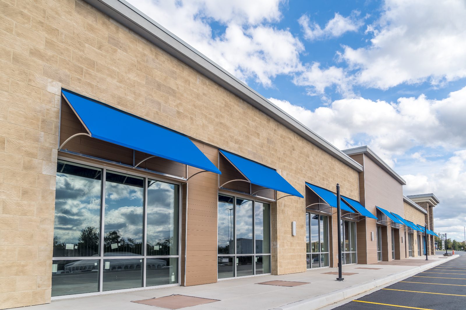 Retail storefronts with blue awnings